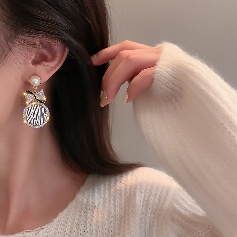 Diamond-Style Pearl Bow Earrings - Image 4