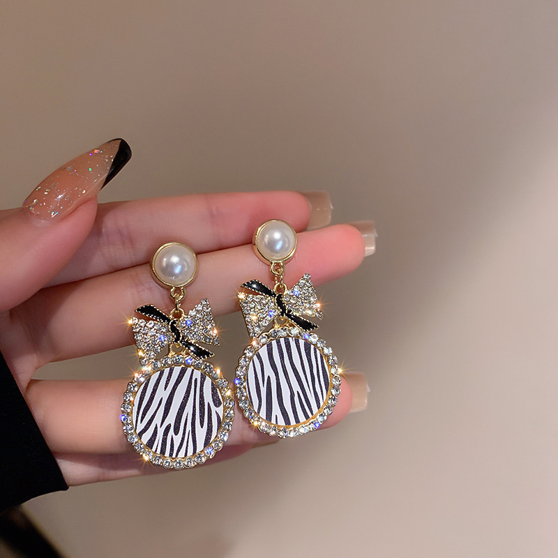 Diamond-Style Pearl Bow Earrings - Image 2