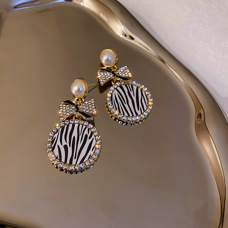 Diamond-Style Pearl Bow Earrings - Image 6
