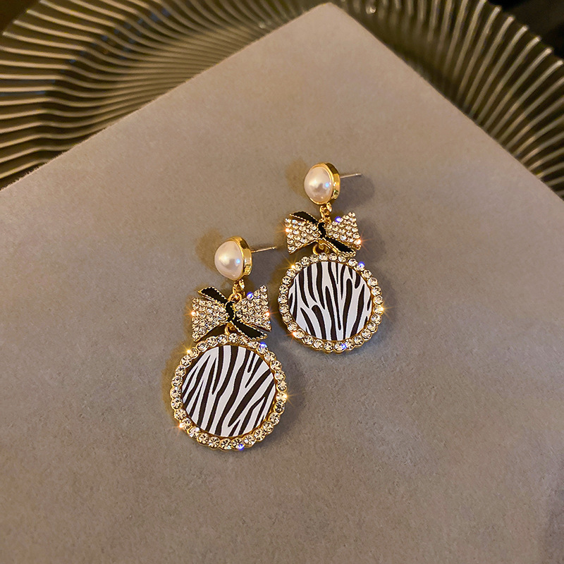 Diamond-Style Pearl Bow Earrings - Image 3